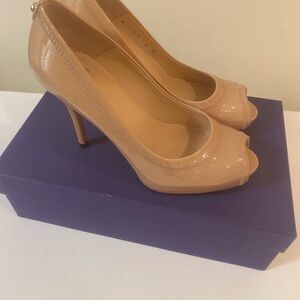 Stuart Weitzman peep toe patent leather stiletto heel.